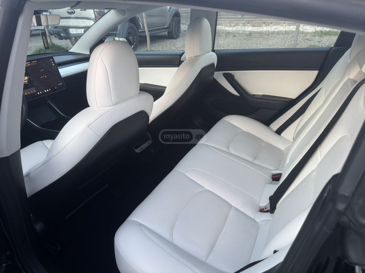 Tesla Model 3 - фото 11
