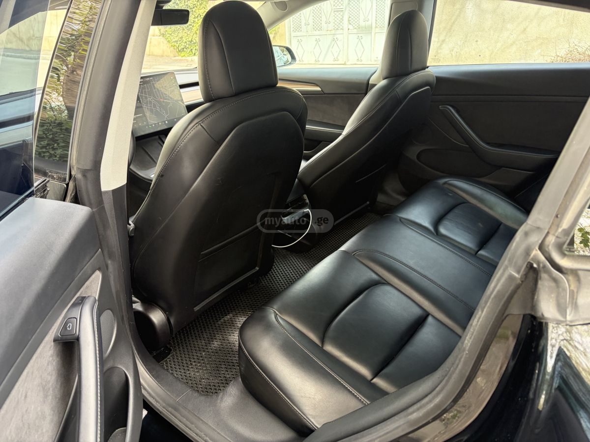 Tesla Model 3 - фото 11