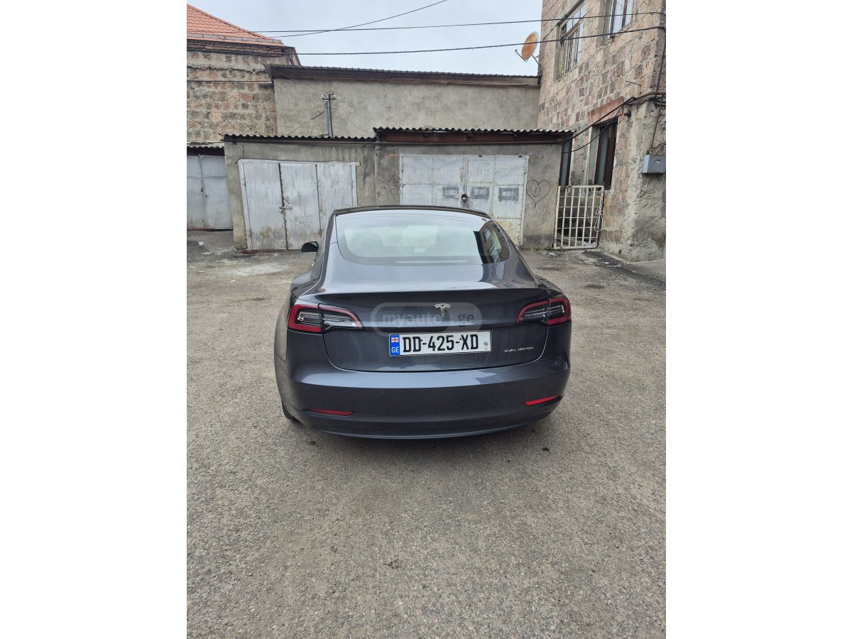 Tesla Model 3 - фото 10