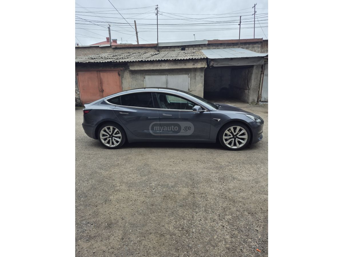 Tesla Model 3 - фото 11