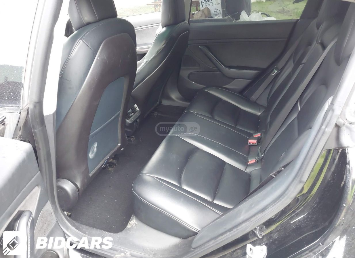 Tesla Model 3 - фото 7