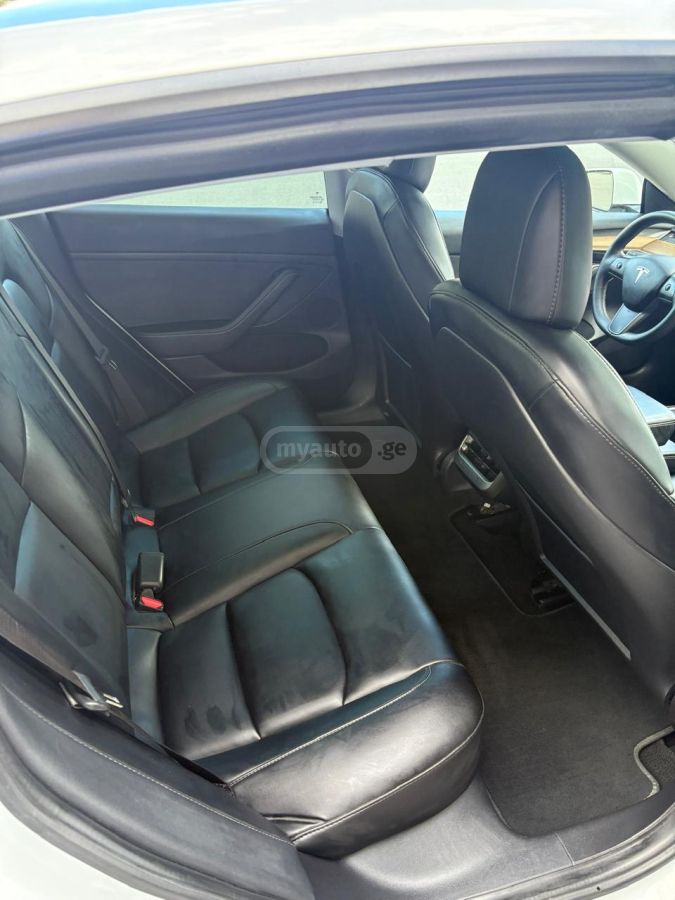 Tesla Model 3 - фото 12