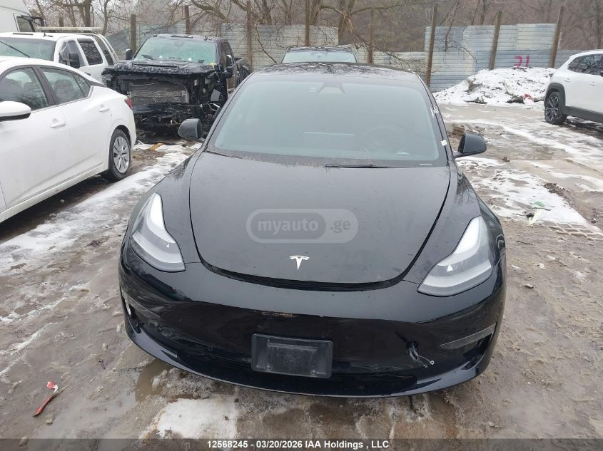 Tesla Model 3 - фото 10