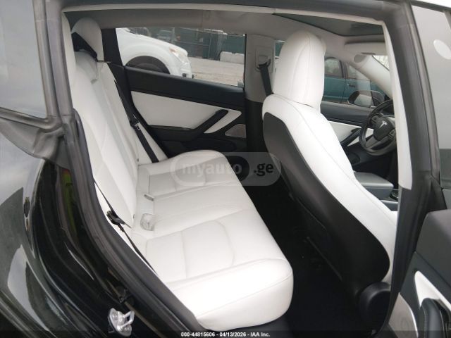 Tesla Model 3 - фото 11