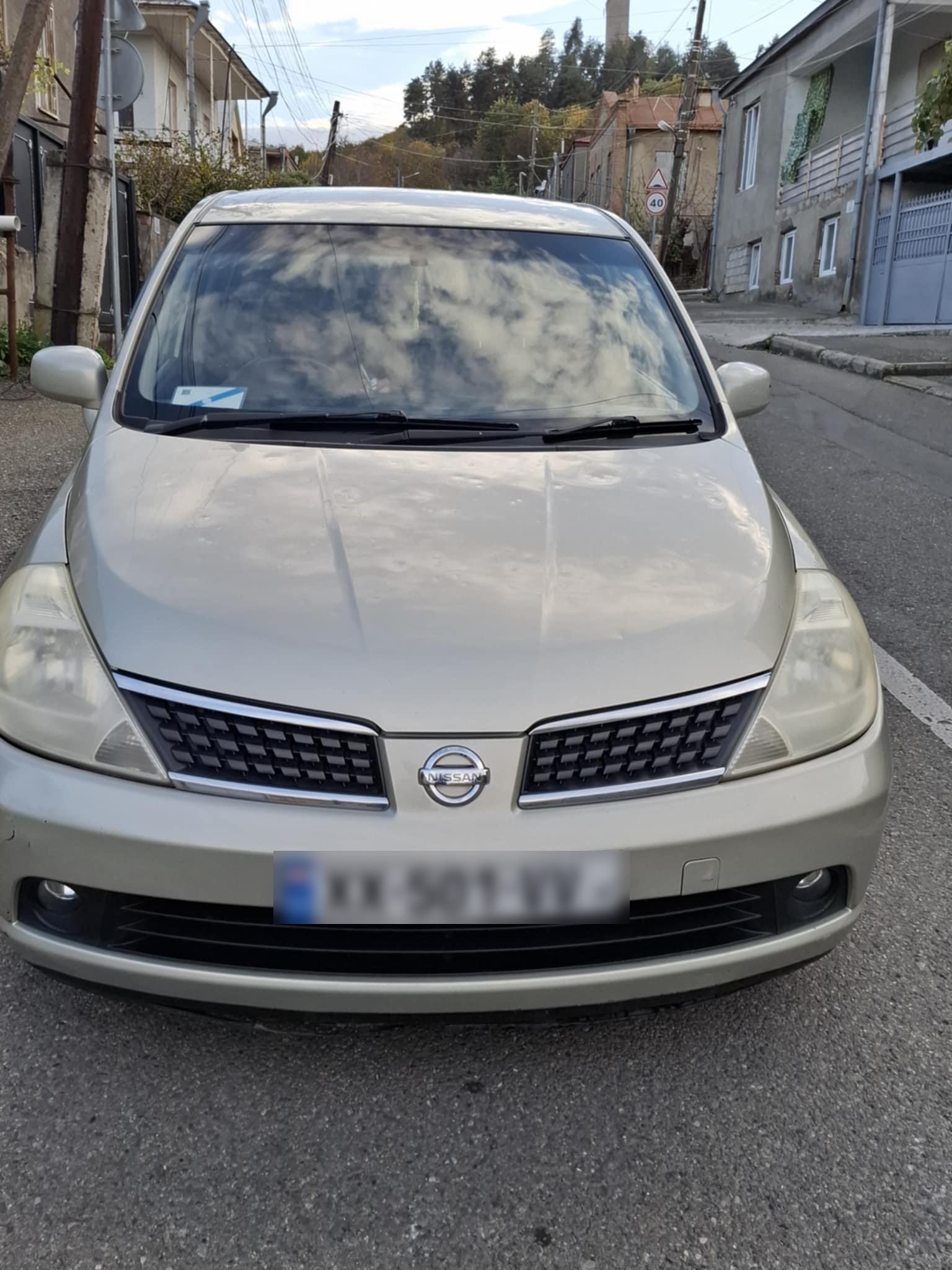 Nissan Tiida - фото 4