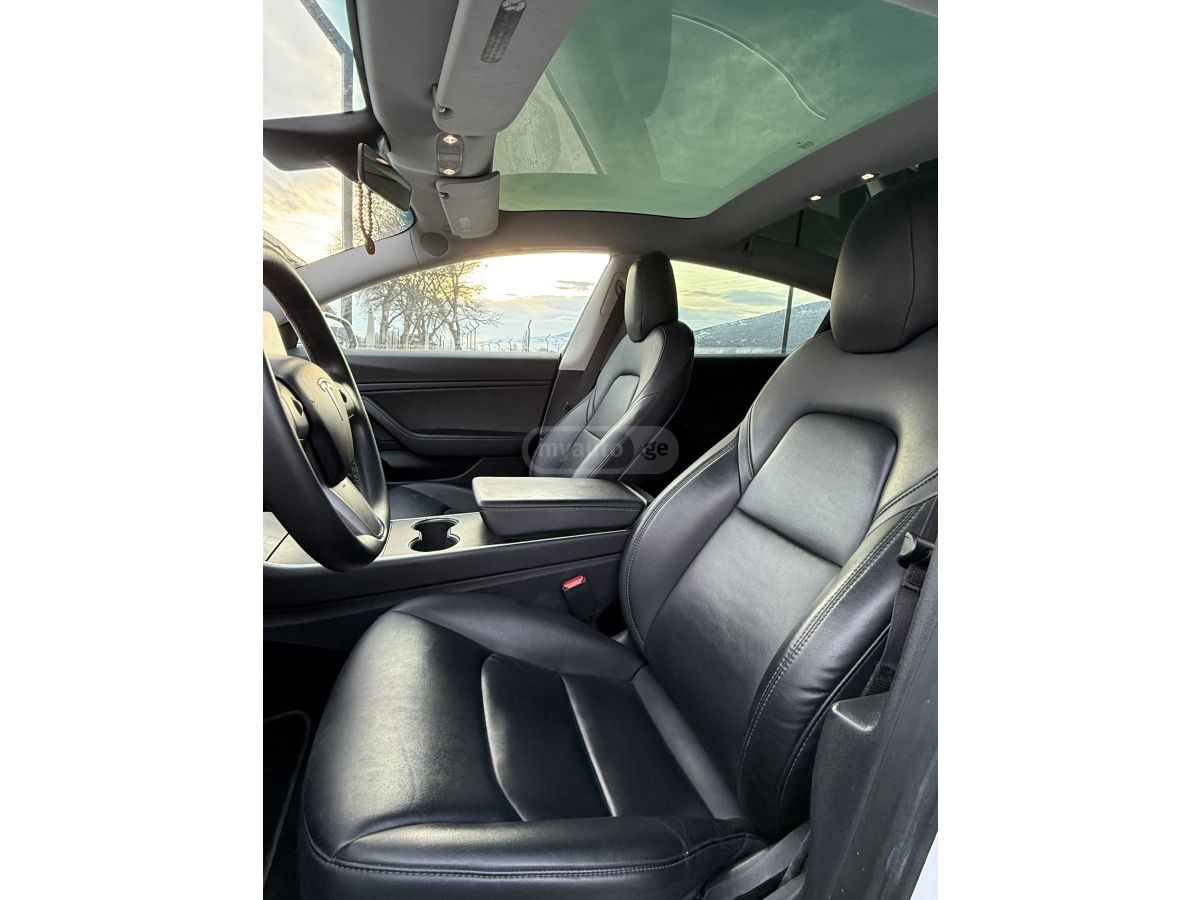 Tesla Model 3 - фото 10