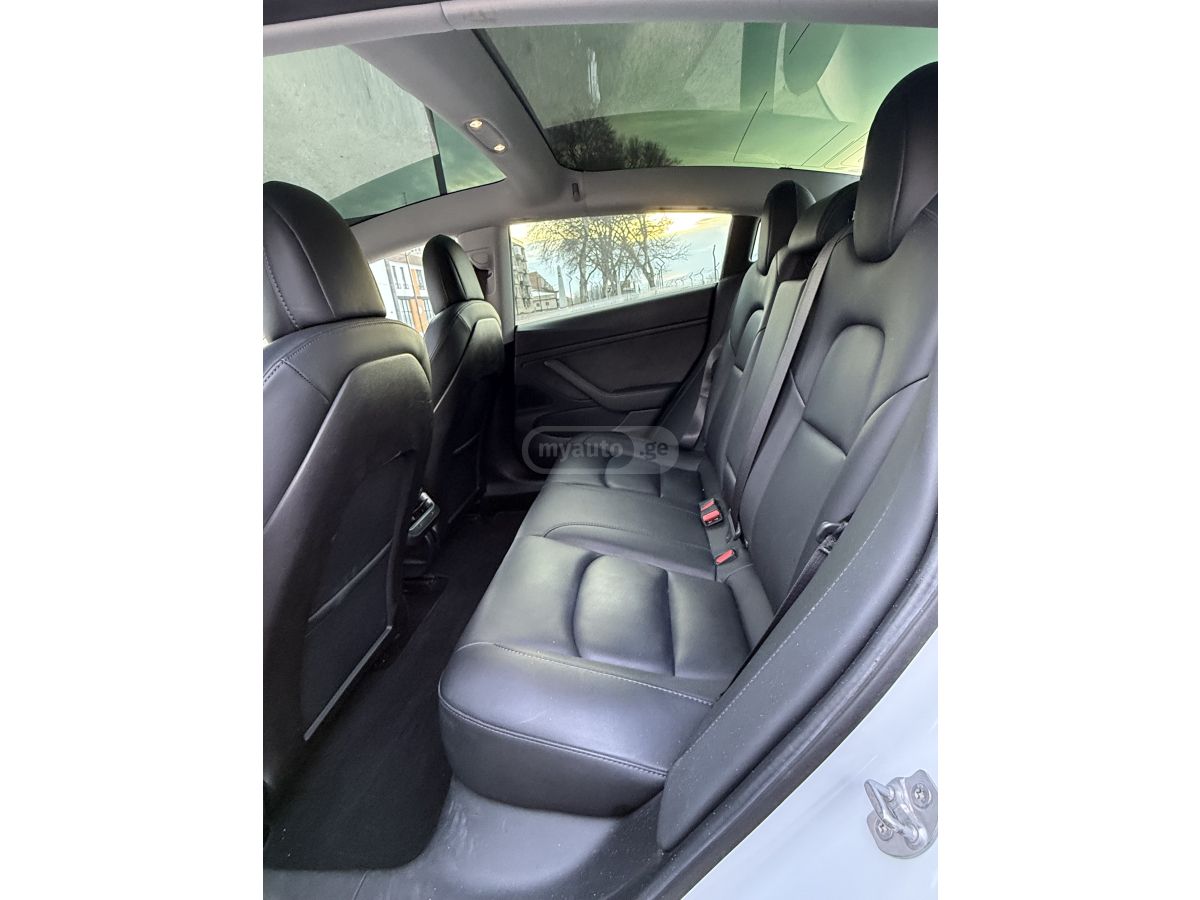 Tesla Model 3 - фото 11