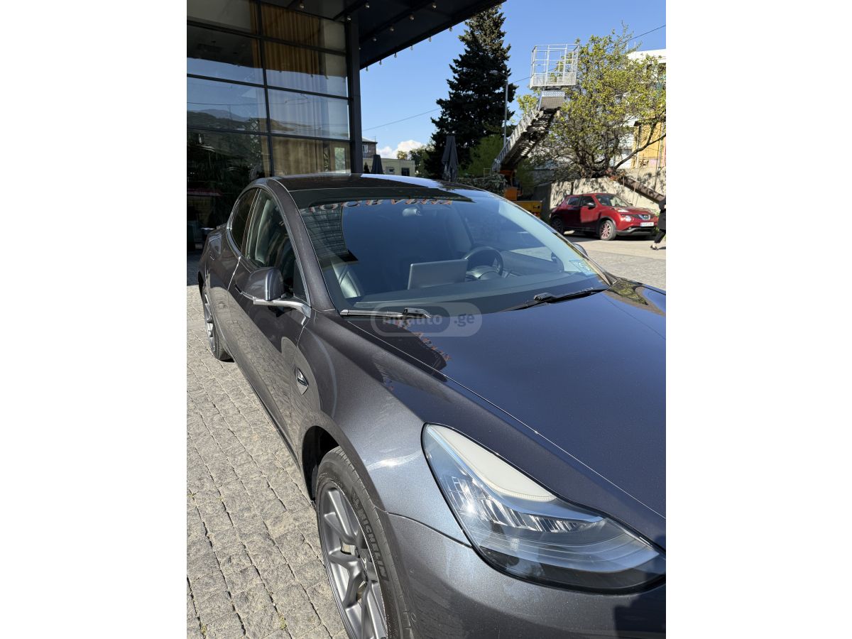 Tesla Model 3 - фото 12