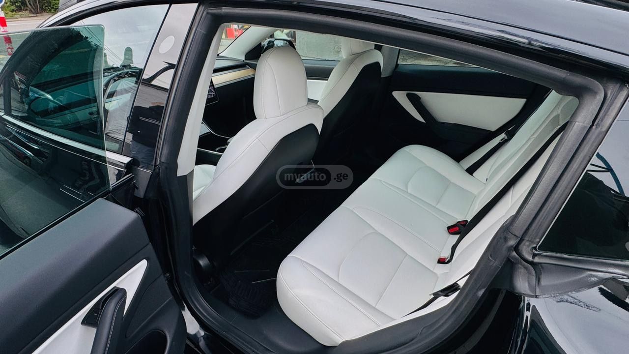 Tesla Model 3 - фото 11