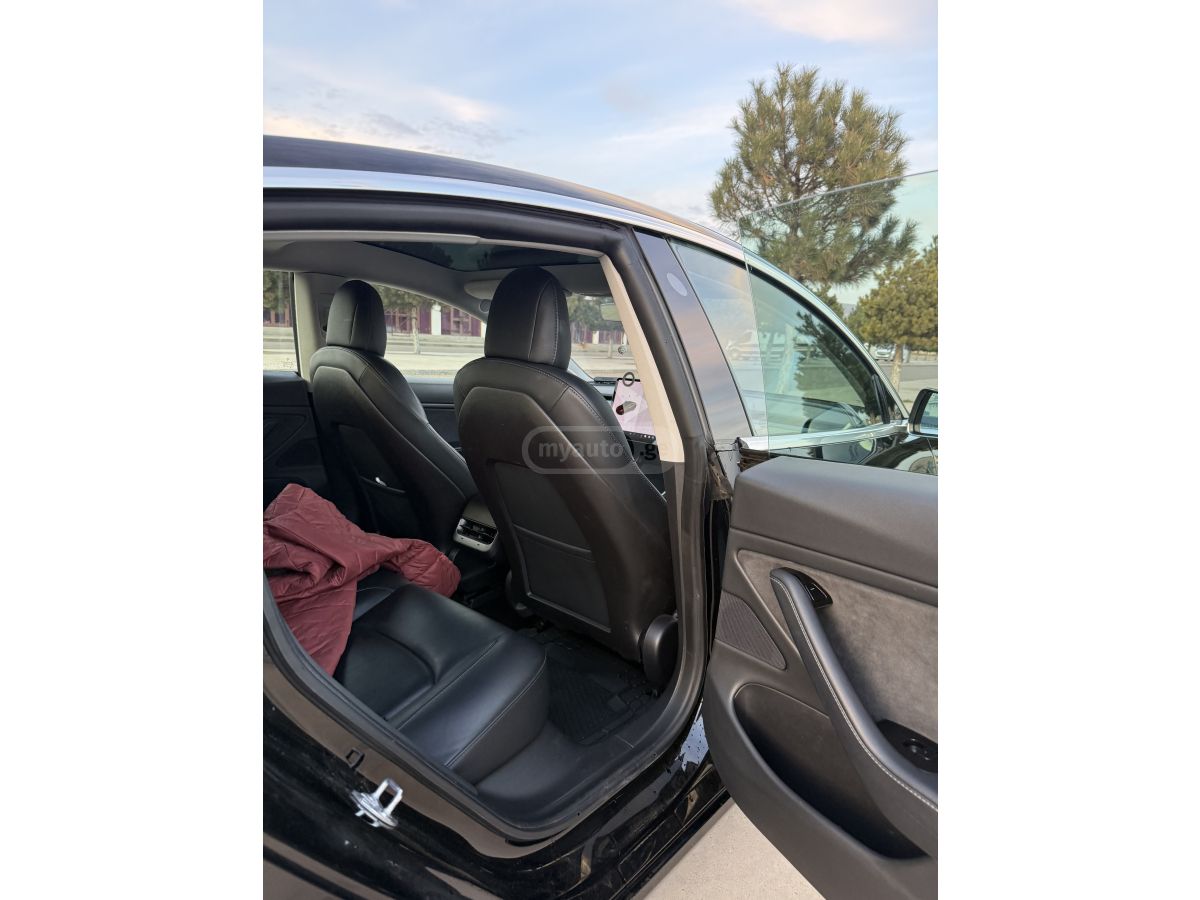 Tesla Model 3 - фото 8