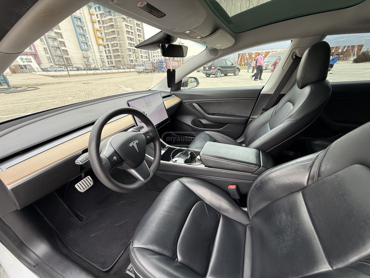 Tesla Model 3 - фото 10