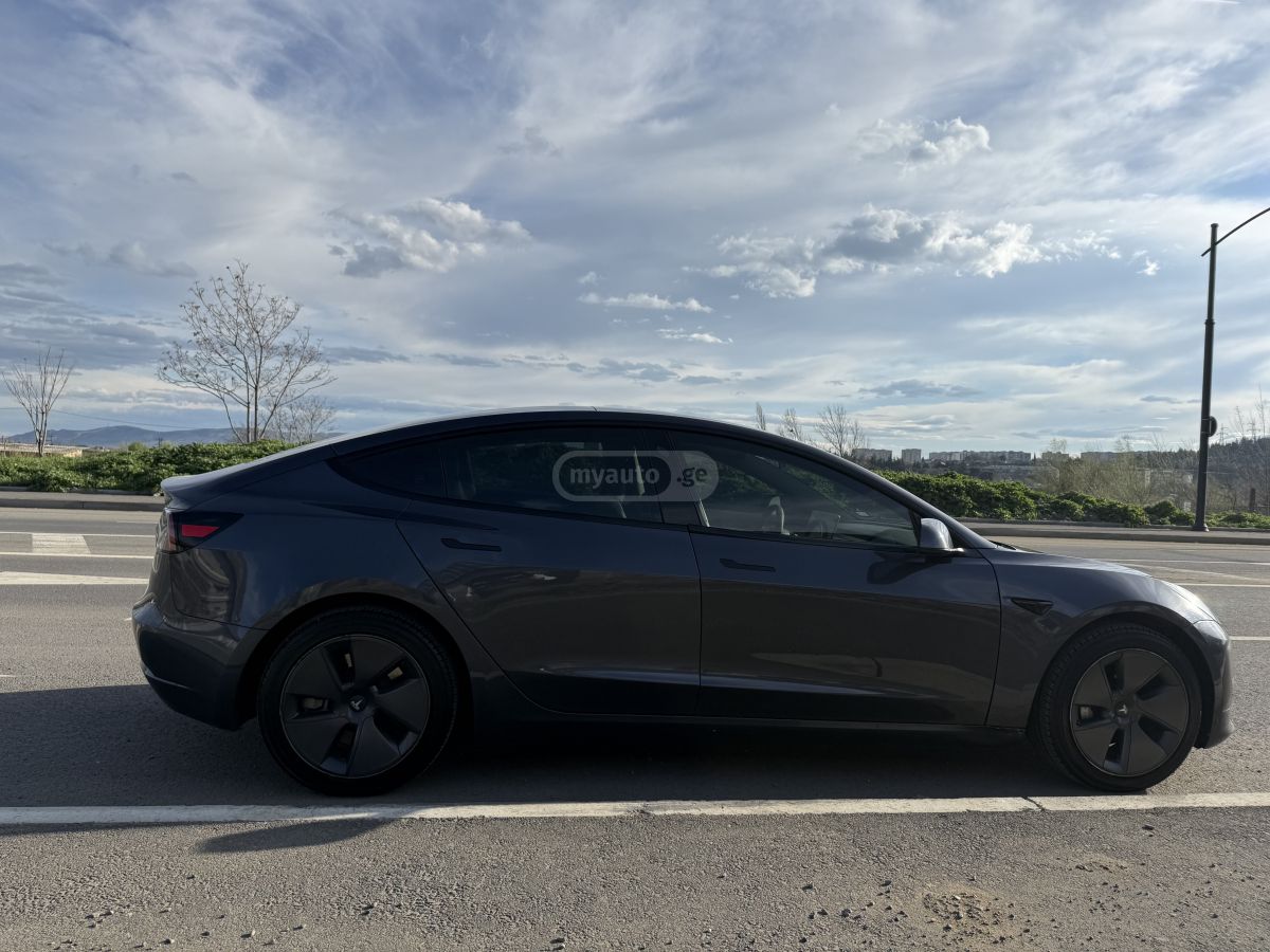 Tesla Model 3 - фото 11