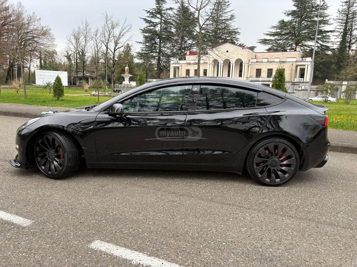 Tesla Model 3 - фото 11
