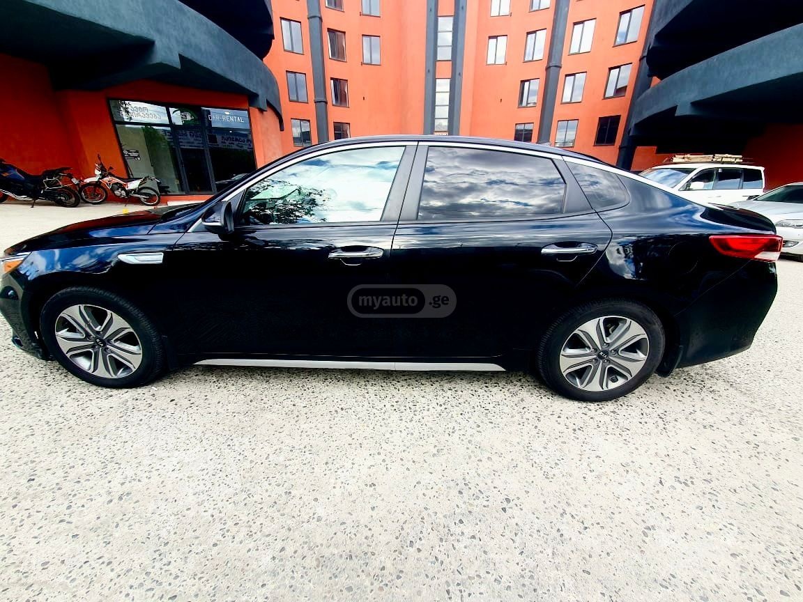 Kia Optima - фото 6