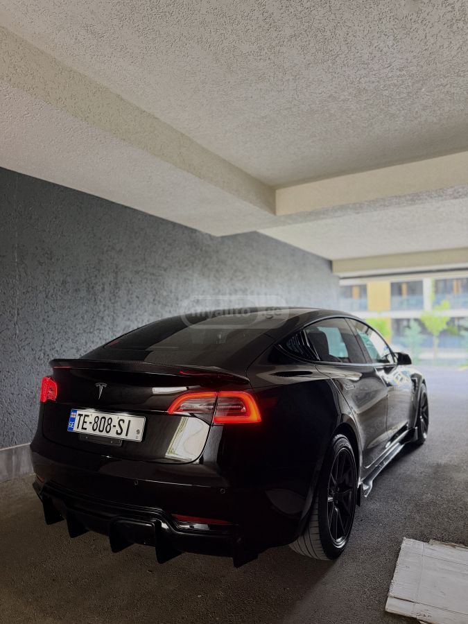Tesla Model 3 - фото 11