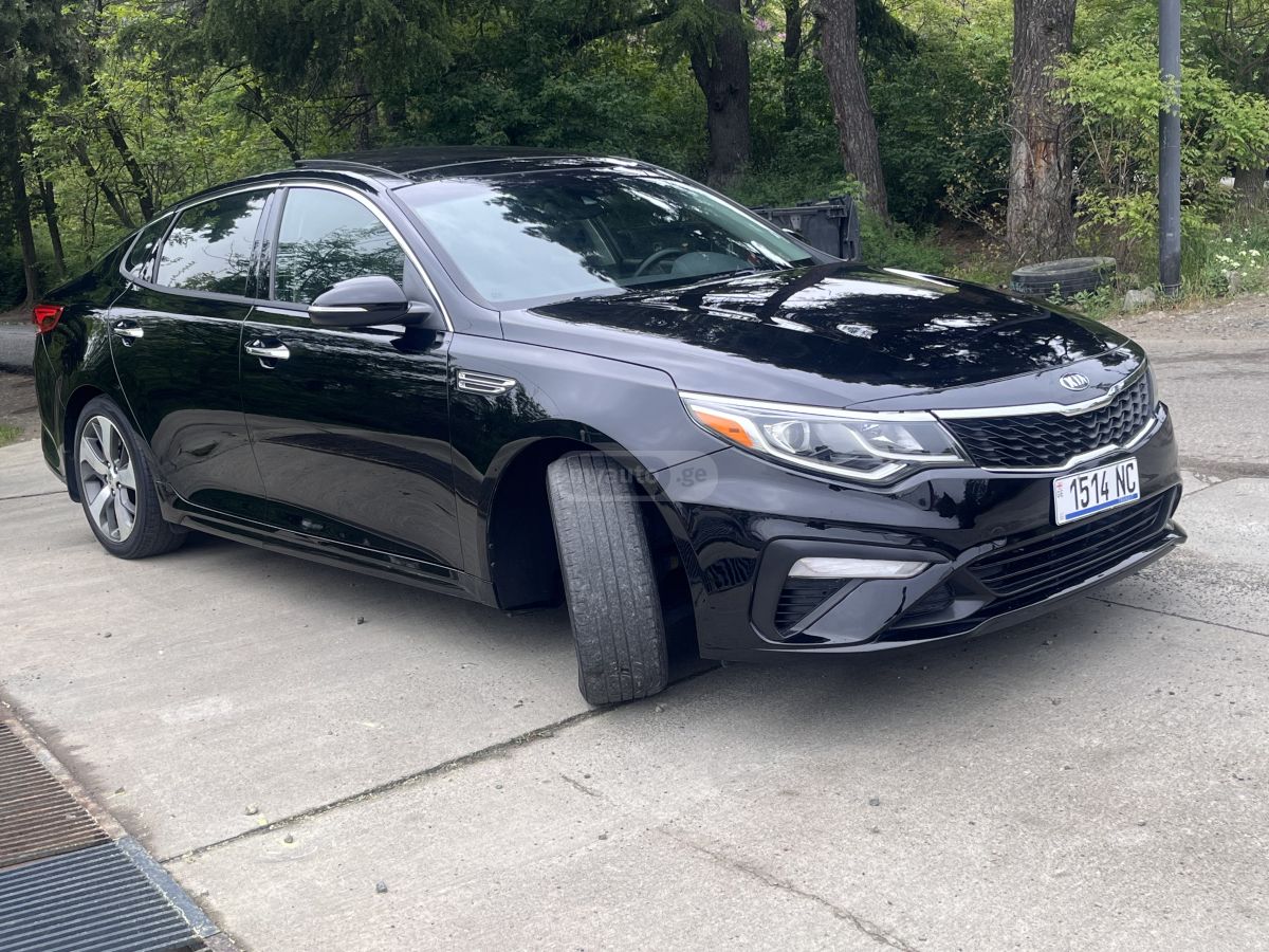 Kia Optima - фото 12