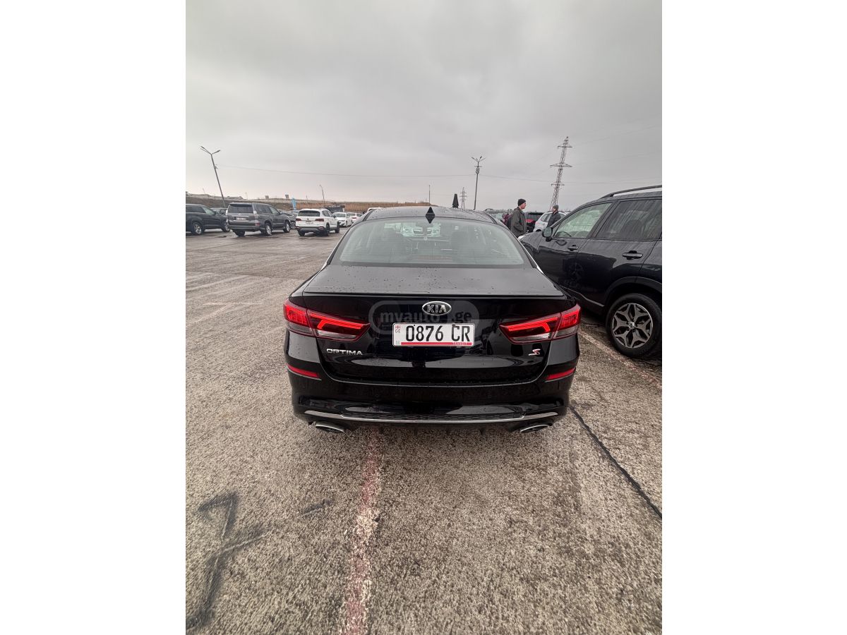 Kia Optima - фото 6
