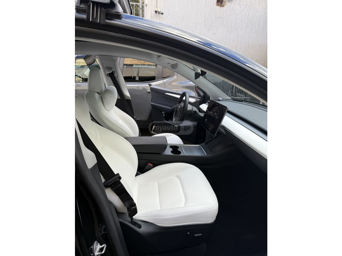Tesla Model Y - фото 11