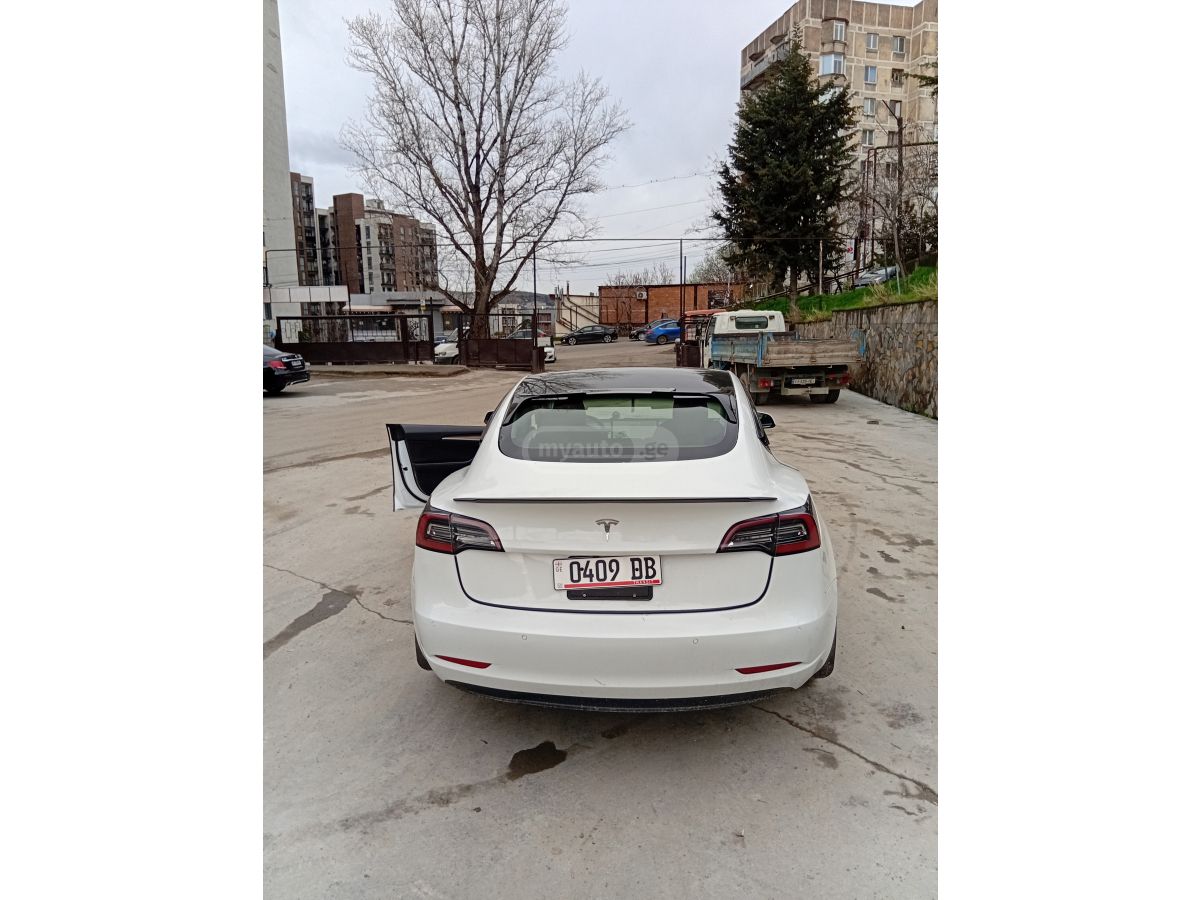 Tesla Model 3 - фото 11