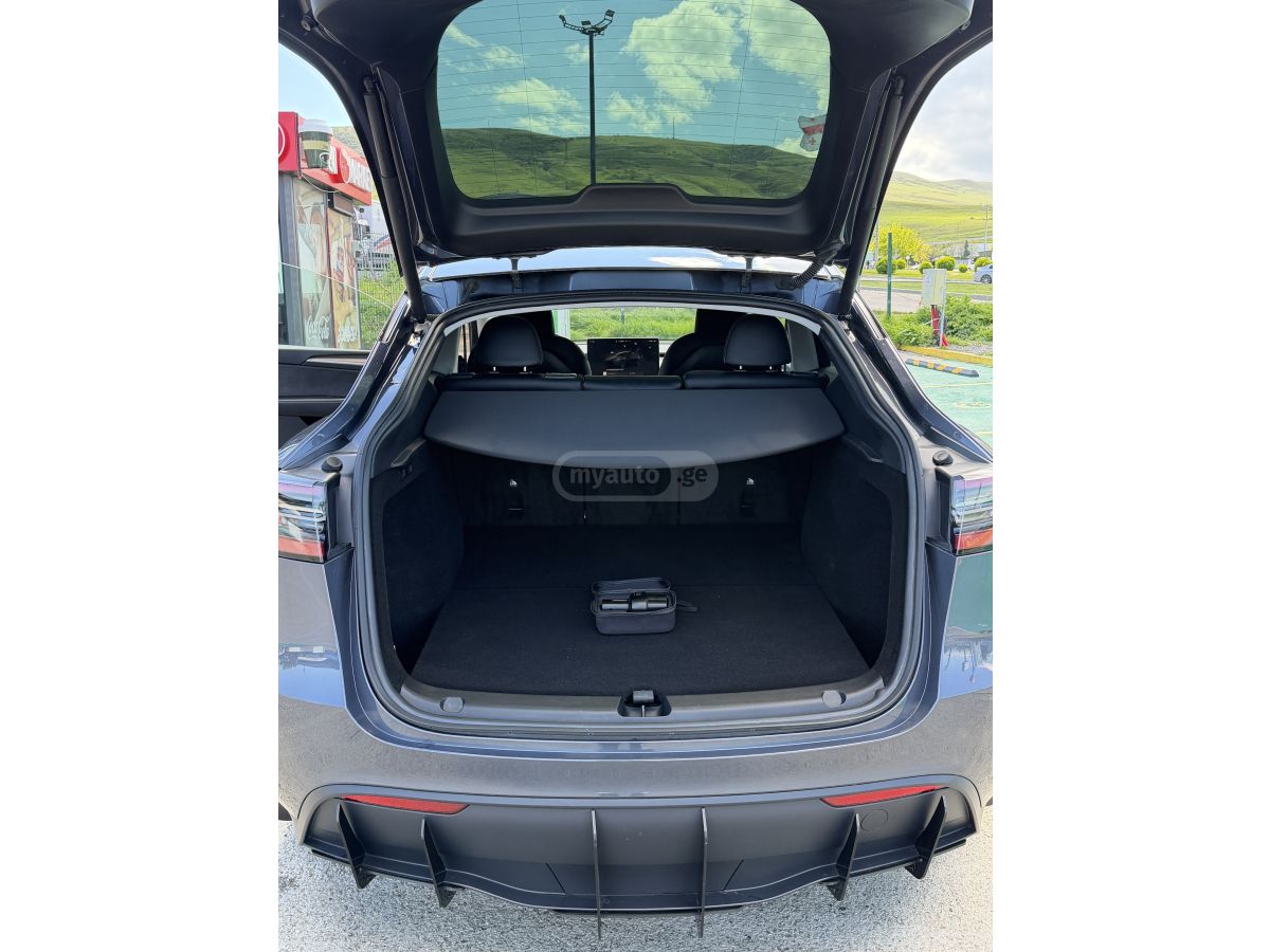 Tesla Model Y - фото 11