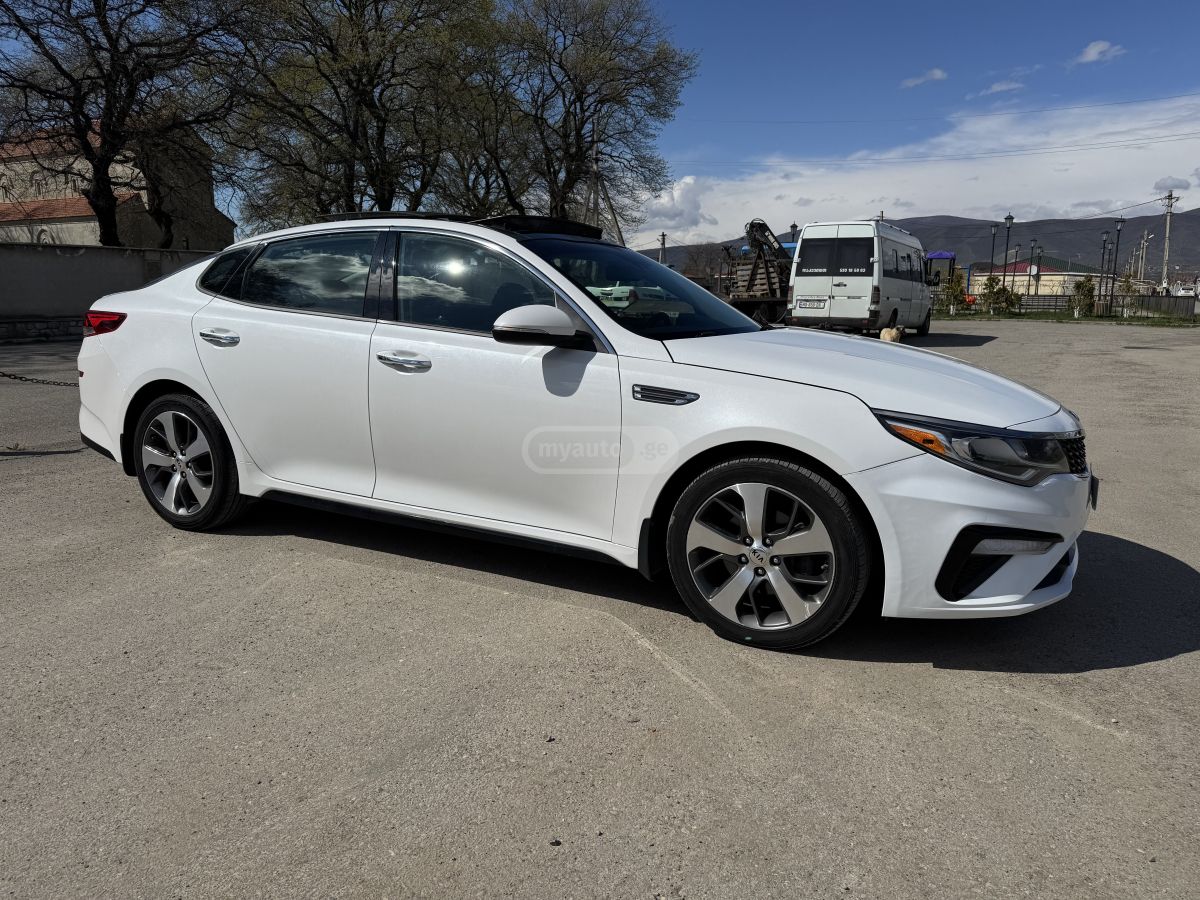 Kia Optima - фото 4