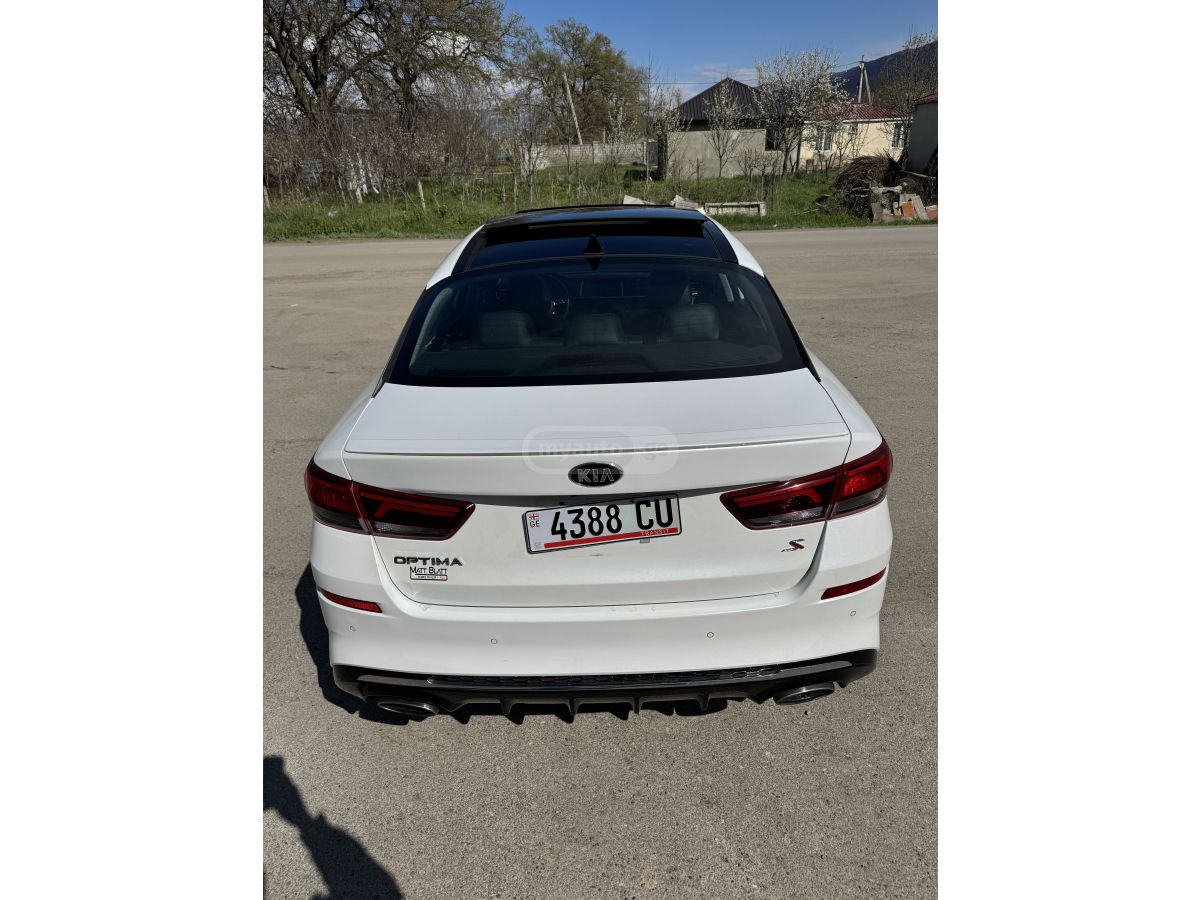 Kia Optima - фото 5
