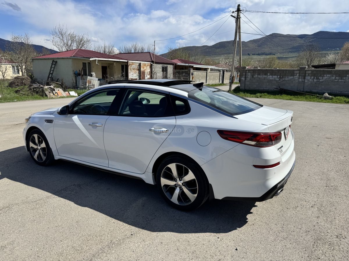 Kia Optima - фото 6