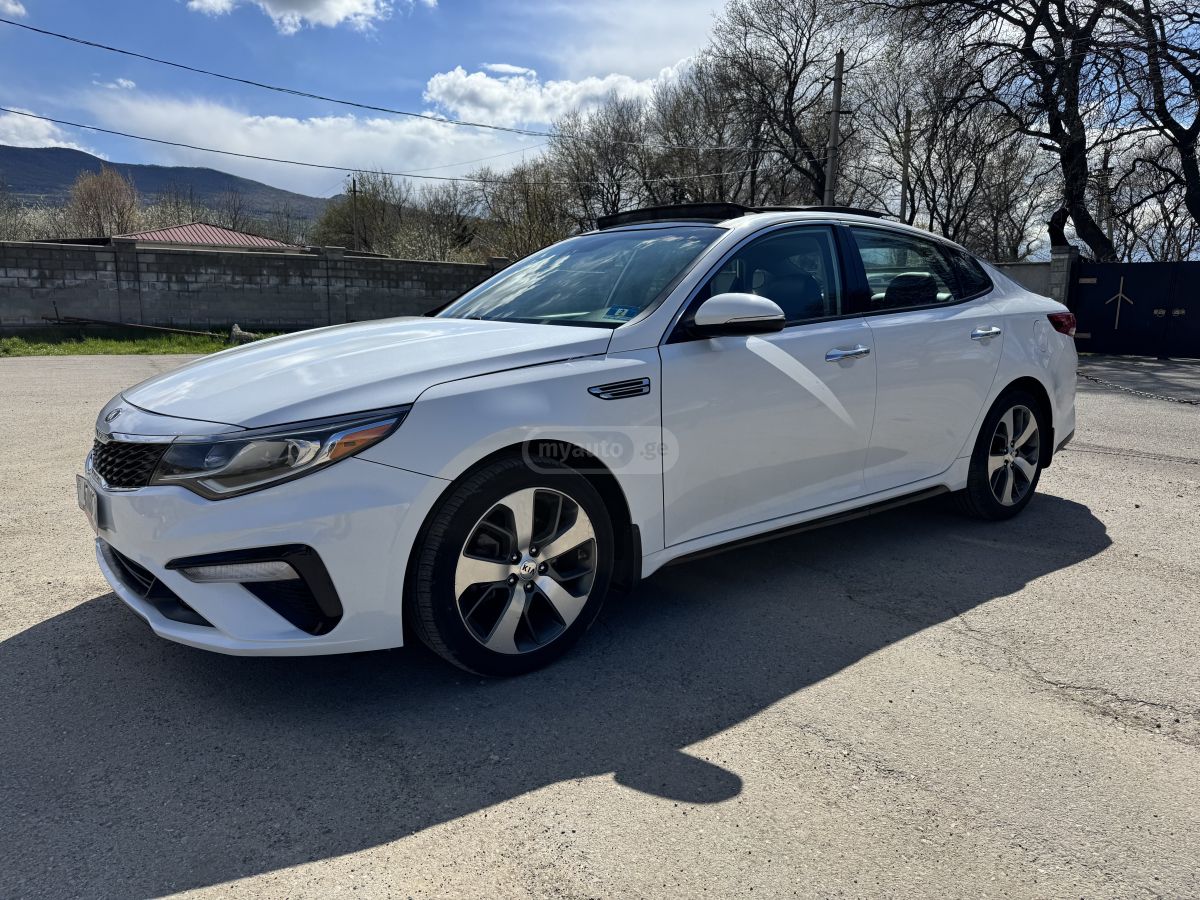 Kia Optima - фото 7