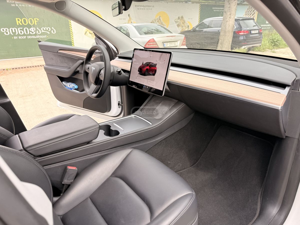 Tesla Model Y - фото 11
