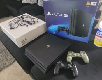 PS4 PRO 1tb with 2 joysticks, 1 year warranty, from the stor